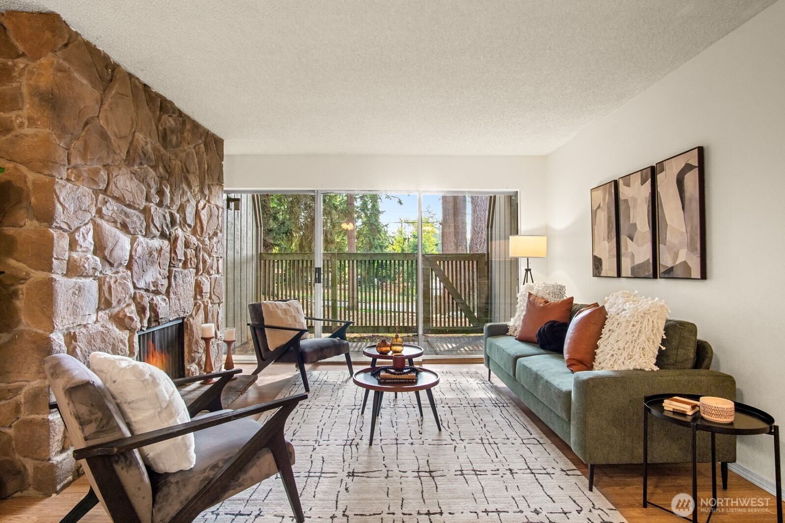 4803 180th Street Southwest, Unit A101 Lynnwood, WA 98037 - Photo 9 of 24 a living room with furniture and a large window