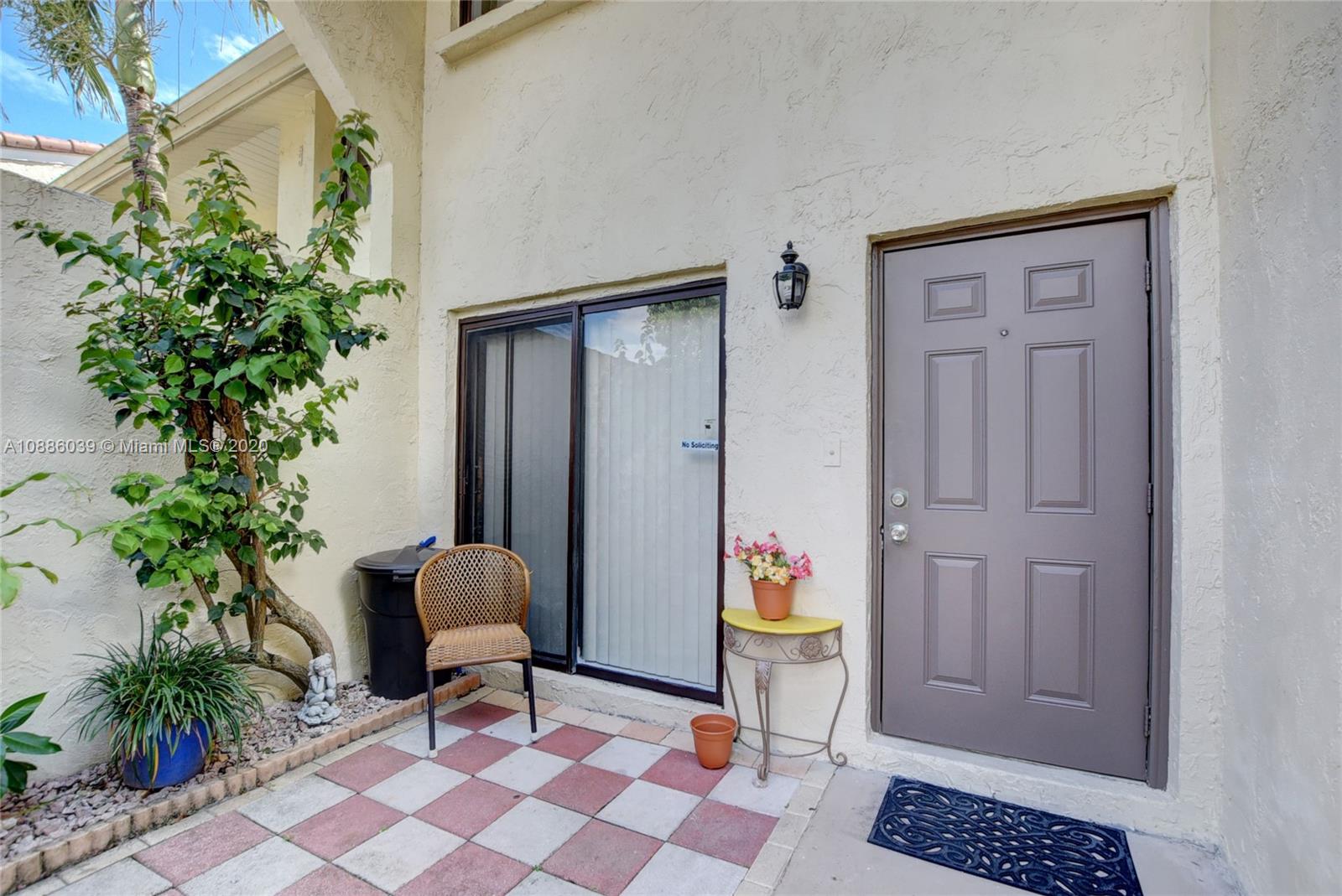 22415 Southwest 61st Way, Unit 107 Boca Raton, FL 33428 - Photo 3 of 48 a living room with furniture and a potted plant