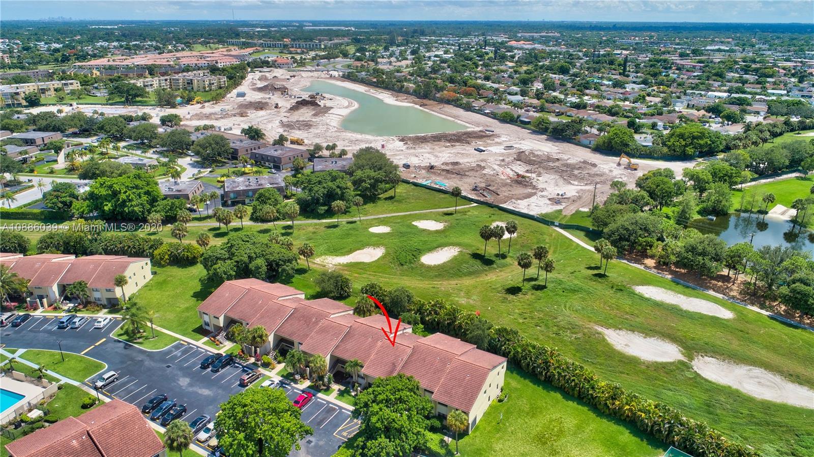 22415 Southwest 61st Way, Unit 107 Boca Raton, FL 33428 - Photo 41 of 48 an aerial view of a house with a garden and lake view