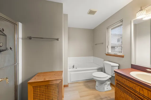 a bathroom with a toilet a sink and bathtub