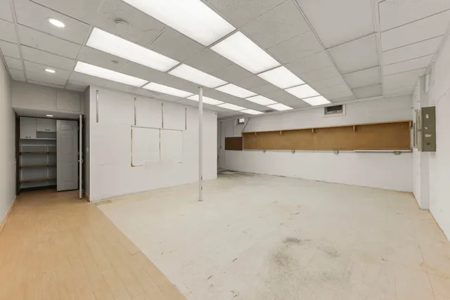an empty room with closet and garage