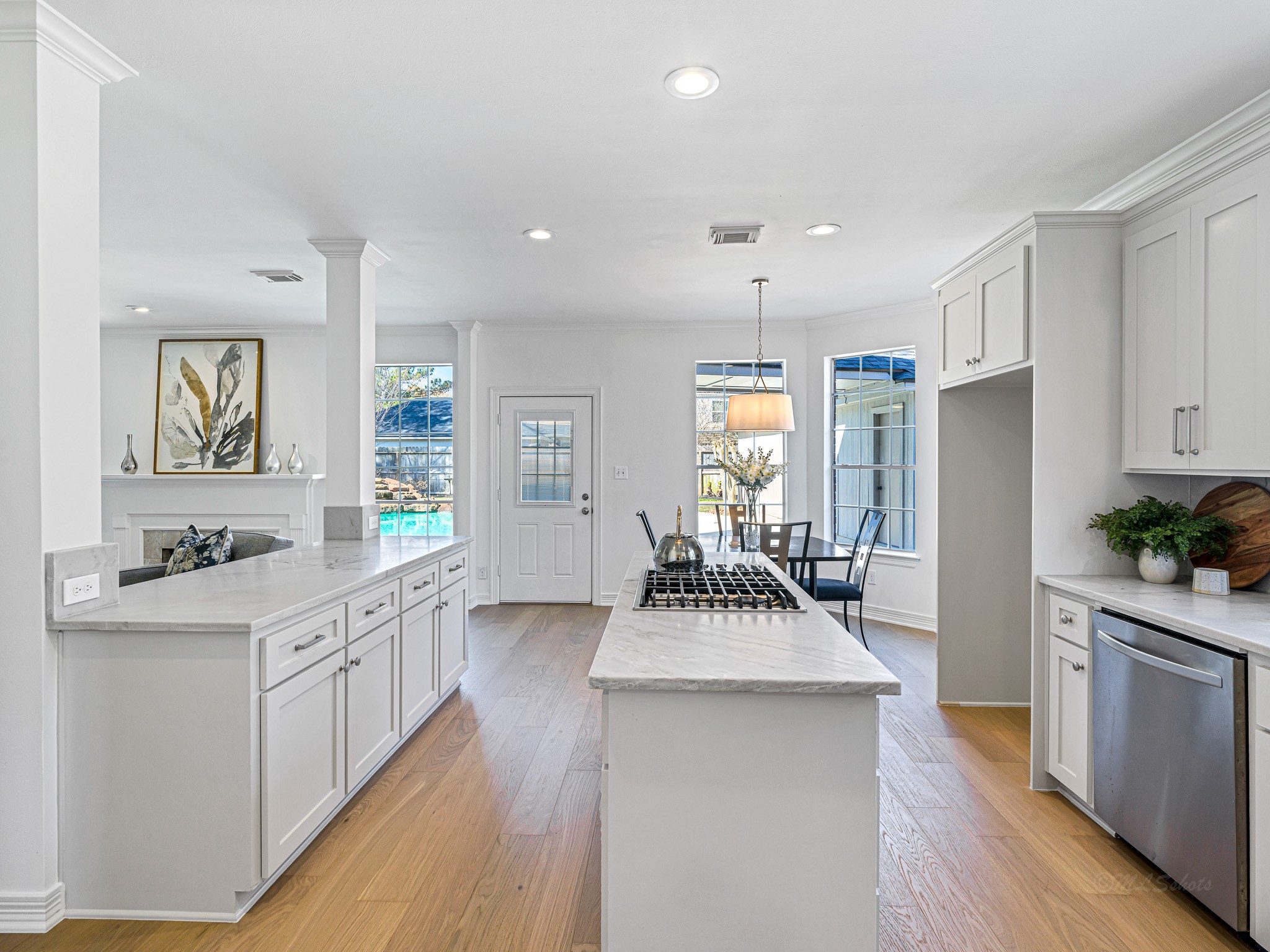 1910 Landon Point Circle Katy, TX 77450 - Photo 14 of 37 Beautiful, soft cabinet color compliments the Quartzite countertops. New recessed lighting, updated flooring, new gas cooktop, brushed nickel hardware all make for a wonderful place to cook, eat and enjoy.