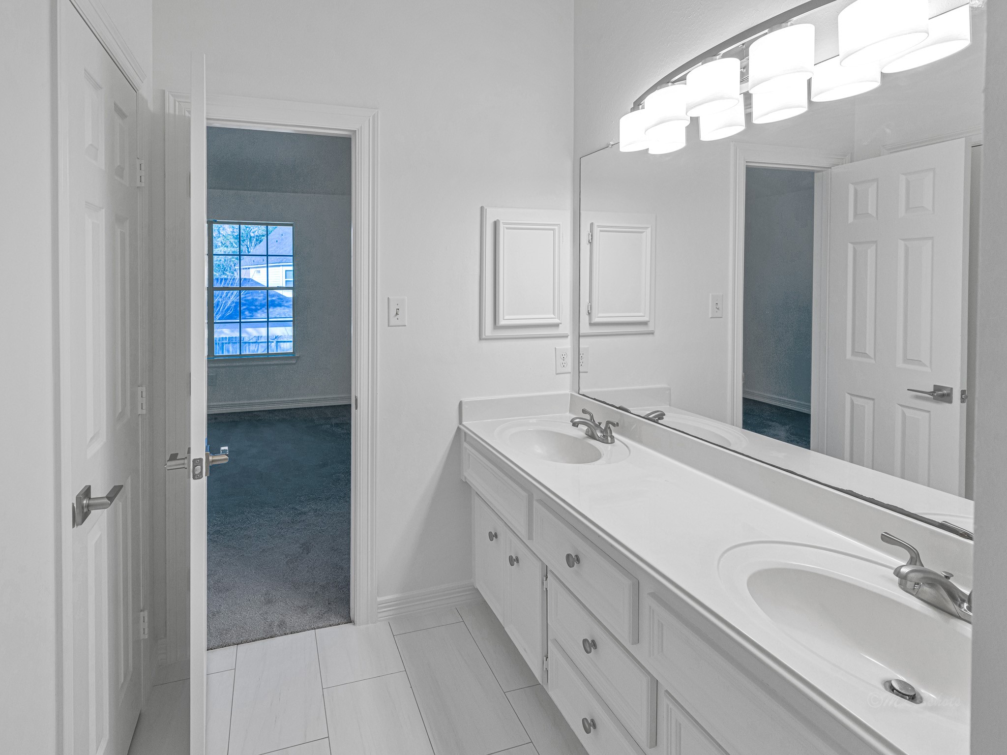 1910 Landon Point Circle Katy, TX 77450 - Photo 28 of 37 Two bedrooms have access to this bathroom with double sinks and separate wet area. New tile flooring and light fixtures.