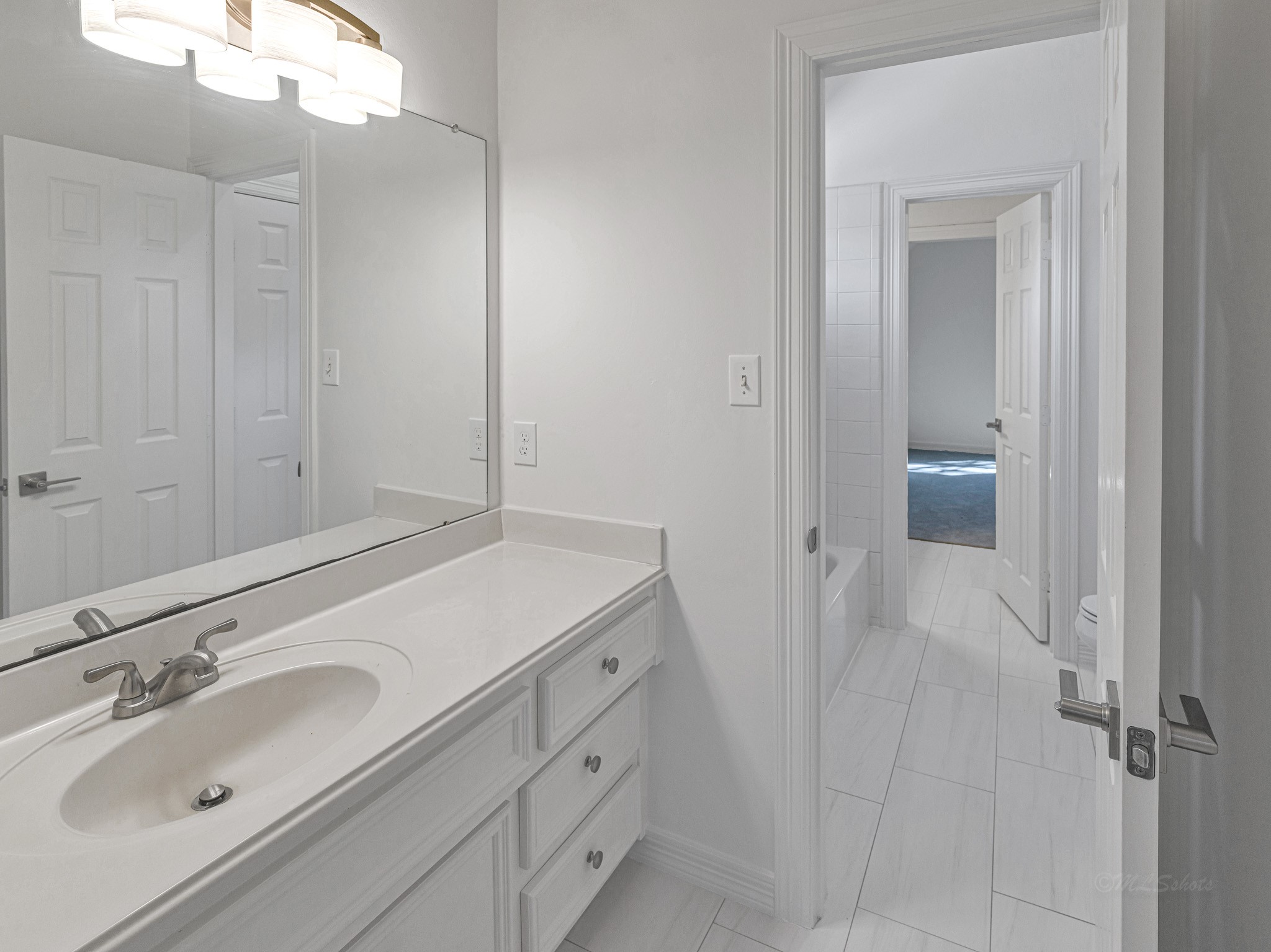 1910 Landon Point Circle Katy, TX 77450 - Photo 30 of 37 Other two bedrooms have separate sink area off the bedroom with access to a shared wet area.