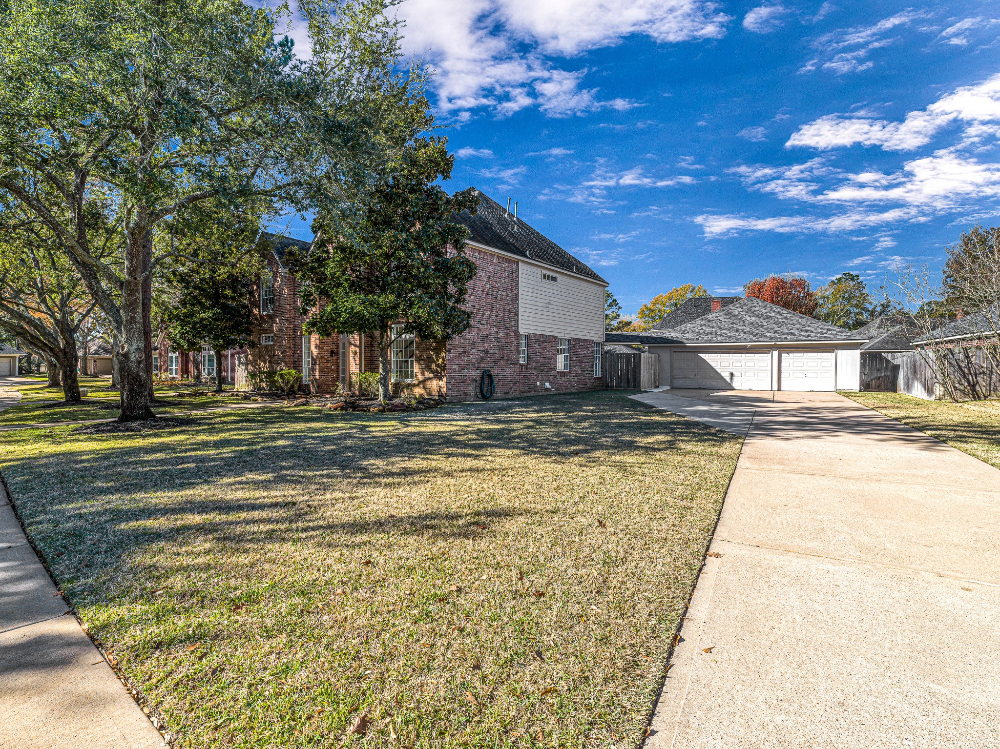 1910 Landon Point Circle Katy, TX 77450 - Photo 34 of 37 The three car garage has an extended pad in front of the garage doors to widen the parking area.