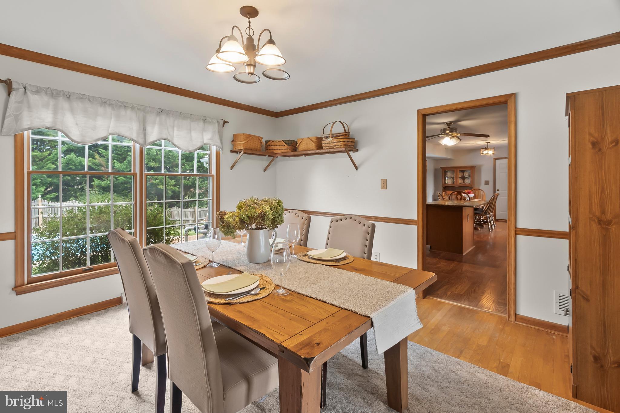 8 Wortham Court Bear, DE 19701 - Photo 15 of 71 a dining room with furniture a chandelier and wooden floor