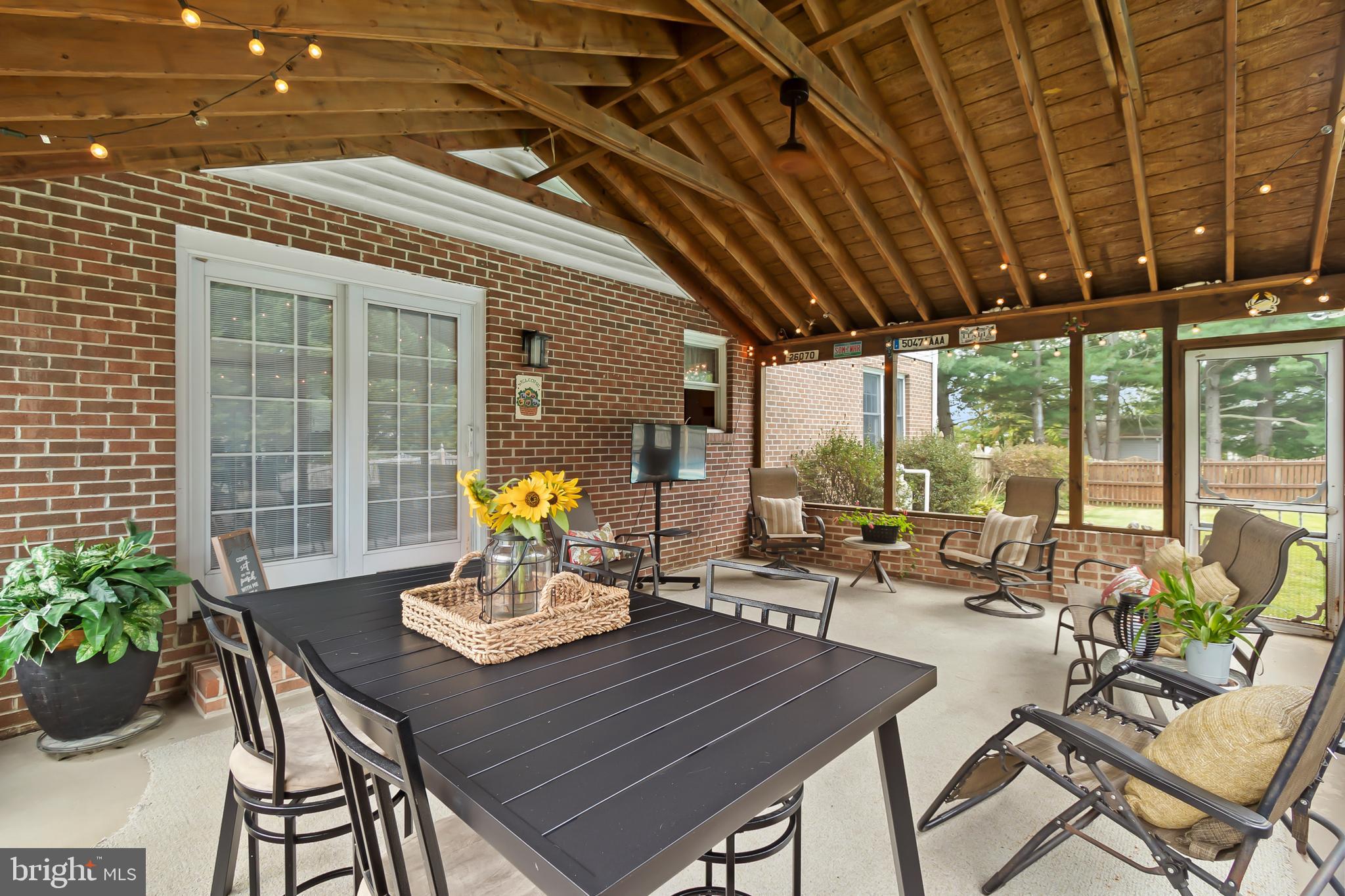 8 Wortham Court Bear, DE 19701 - Photo 26 of 71 a view of a patio with a table and chairs and potted plants