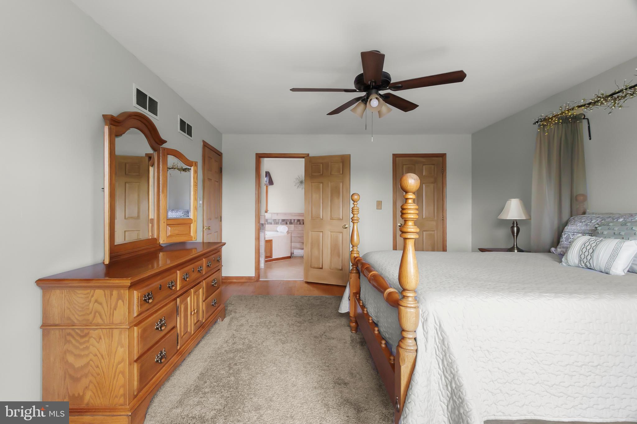 8 Wortham Court Bear, DE 19701 - Photo 33 of 71 a bedroom with a bed and a chandelier