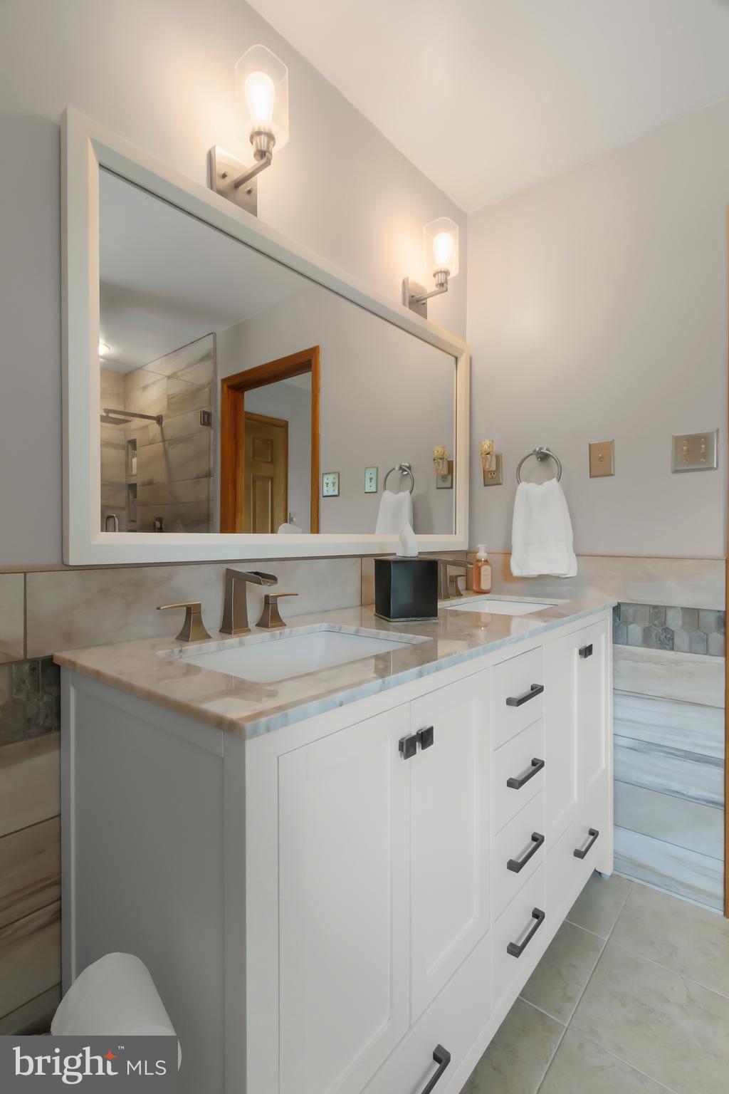 8 Wortham Court Bear, DE 19701 - Photo 37 of 71 a bathroom with a sink and a mirror