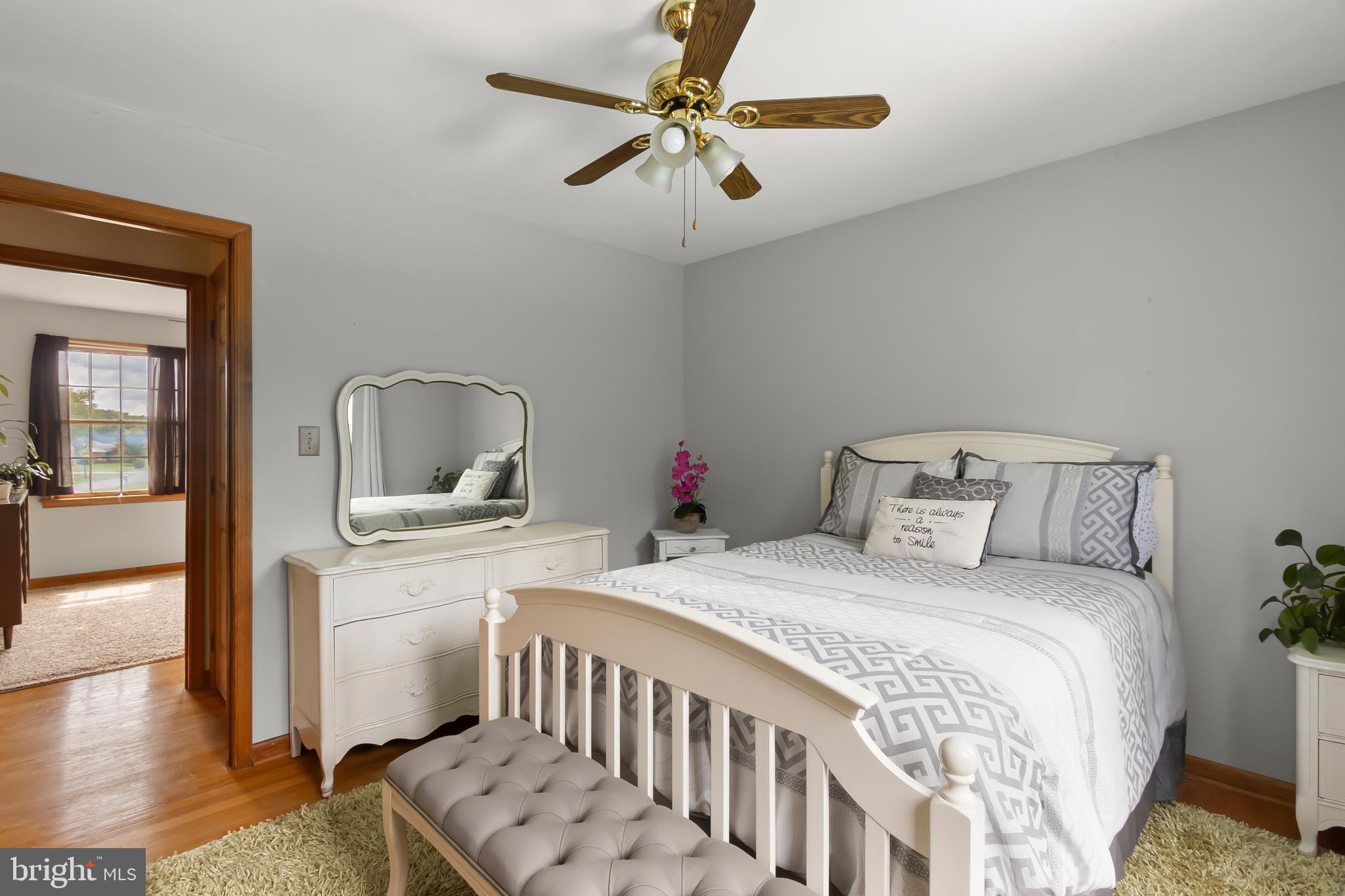 8 Wortham Court Bear, DE 19701 - Photo 44 of 71 a bedroom with a bed a chandelier and mirror