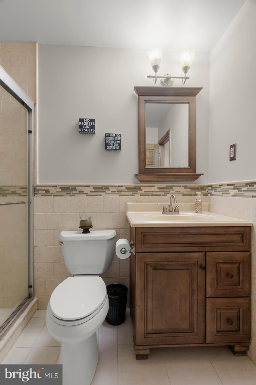 8 Wortham Court Bear, DE 19701 - Photo 49 of 71 a bathroom with a sink a toilet and mirror