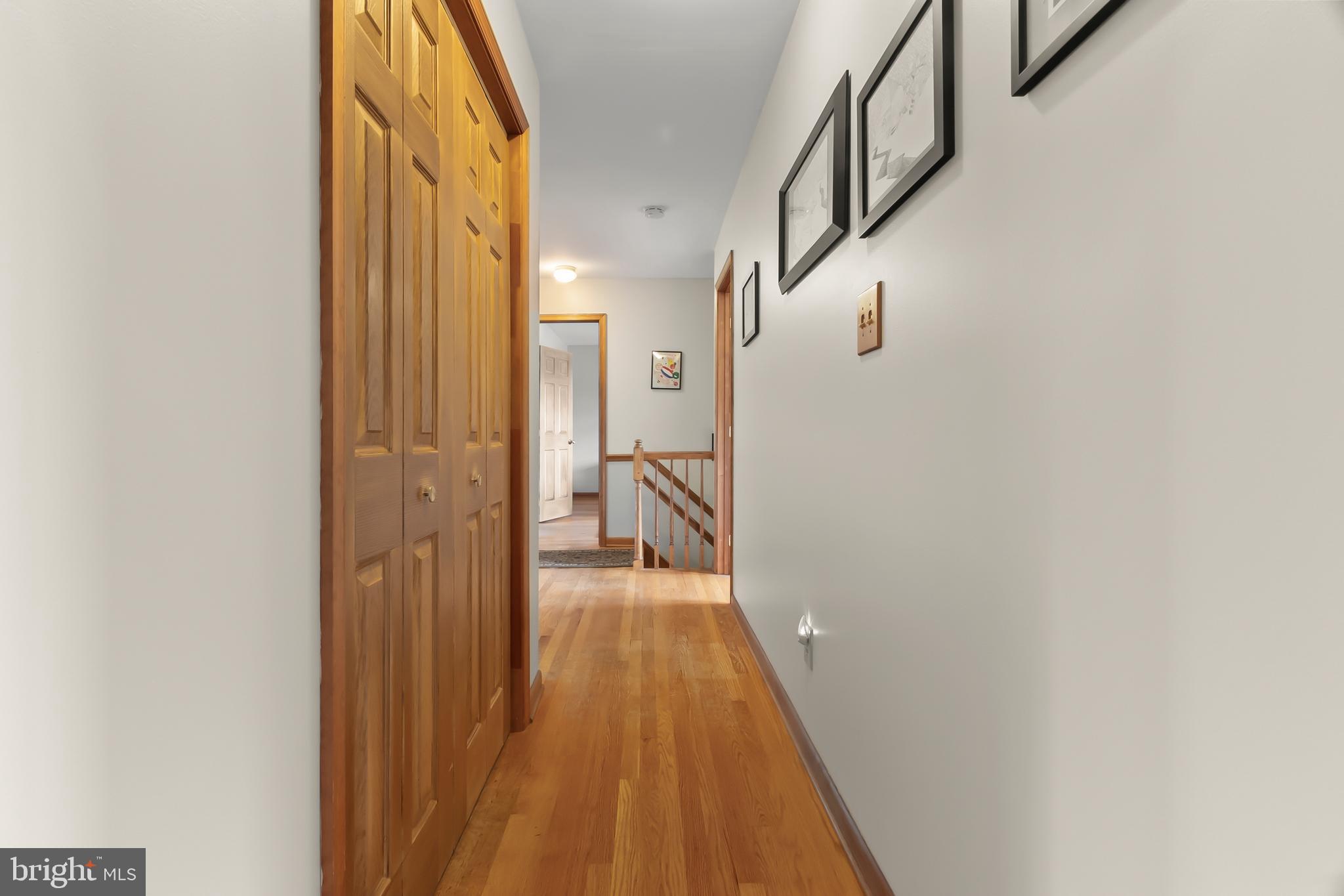 8 Wortham Court Bear, DE 19701 - Photo 52 of 71 a view of a hallway with wooden floor and staircase