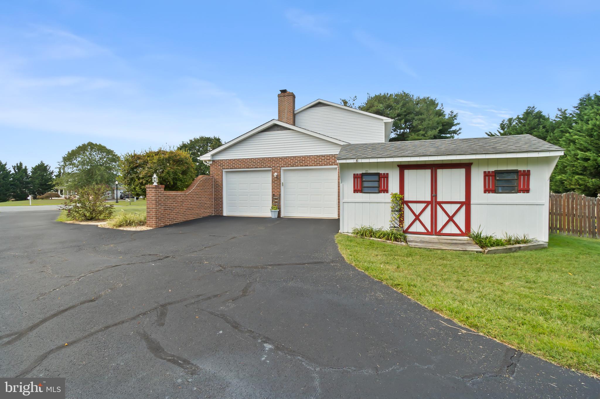8 Wortham Court Bear, DE 19701 - Photo 58 of 71 a front view of a house with a garden and yard