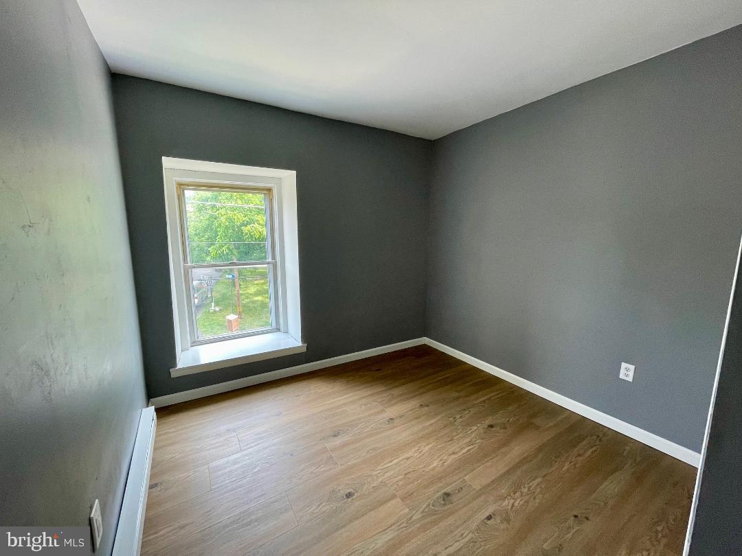 904-906 Main Avenue Croydon, PA 19021 - Photo 31 of 51 an empty room with wooden floor and windows