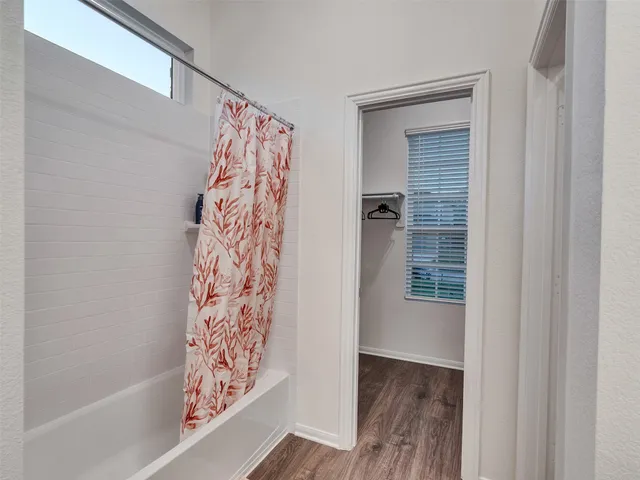 a bathroom with a double vanity sink and mirror