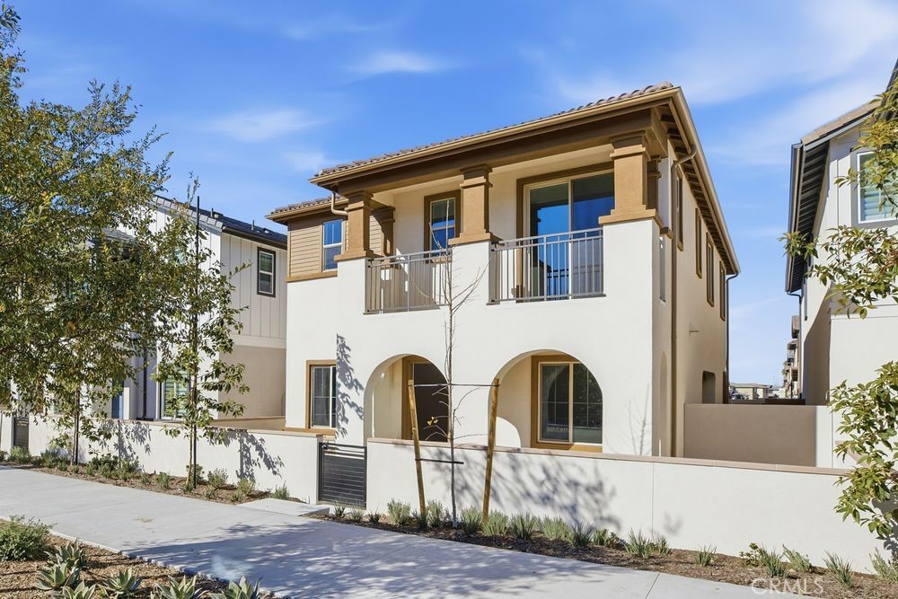 689 Beacon Irvine, CA 92618 - Photo 1 of 1 a front view of a residential apartment building with a yard