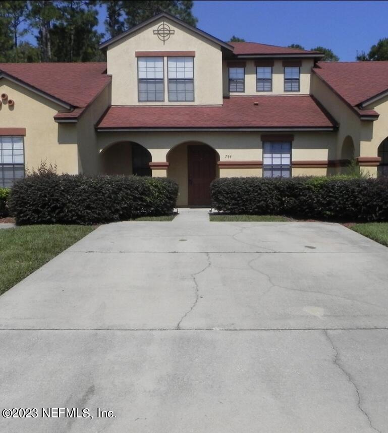 744 Ginger Mill Drive St. Johns, FL 32259 - Photo 2 of 28 a front view of a house with yard