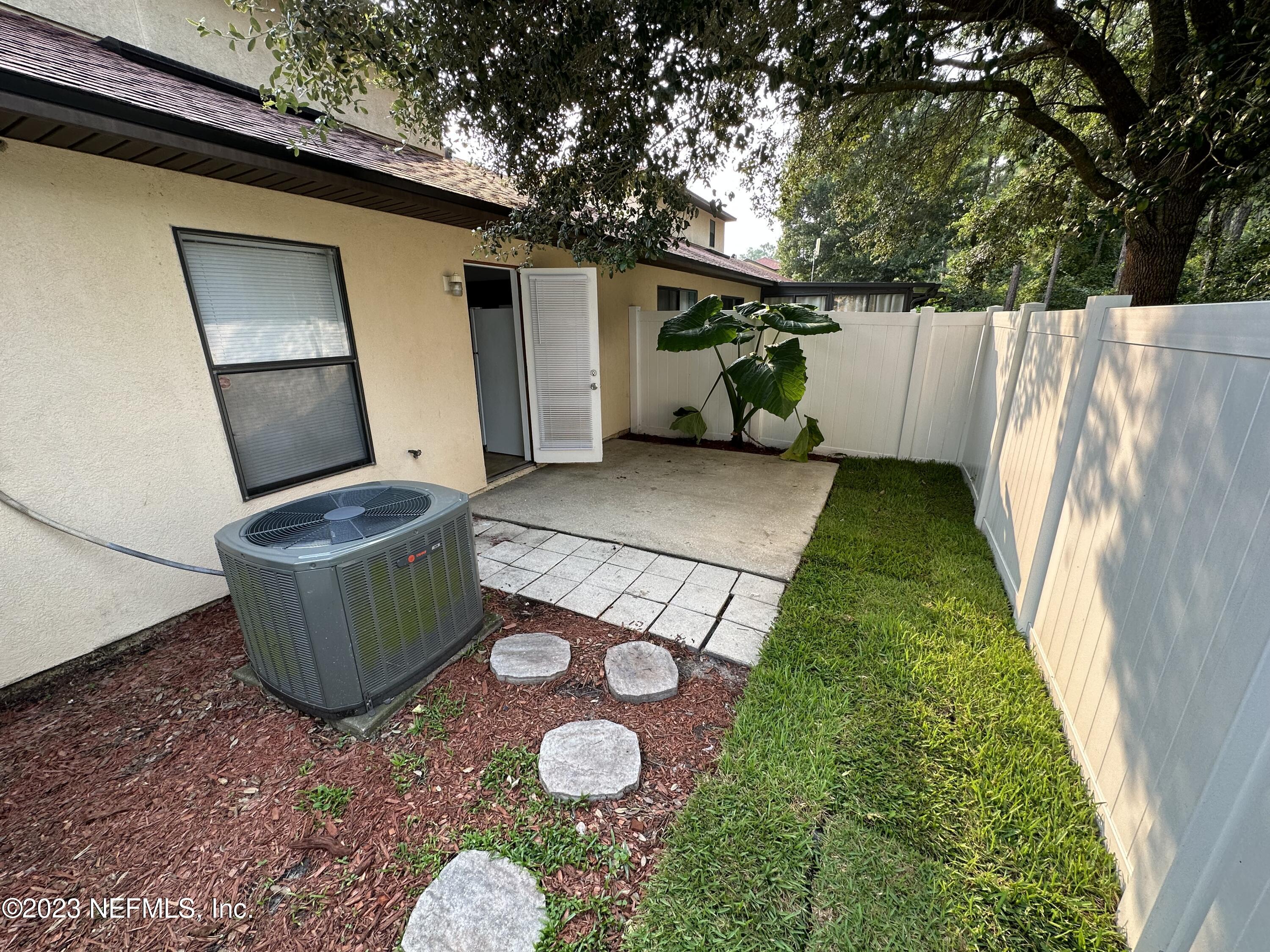 744 Ginger Mill Drive St. Johns, FL 32259 - Photo 22 of 28 a front view of a house with garden