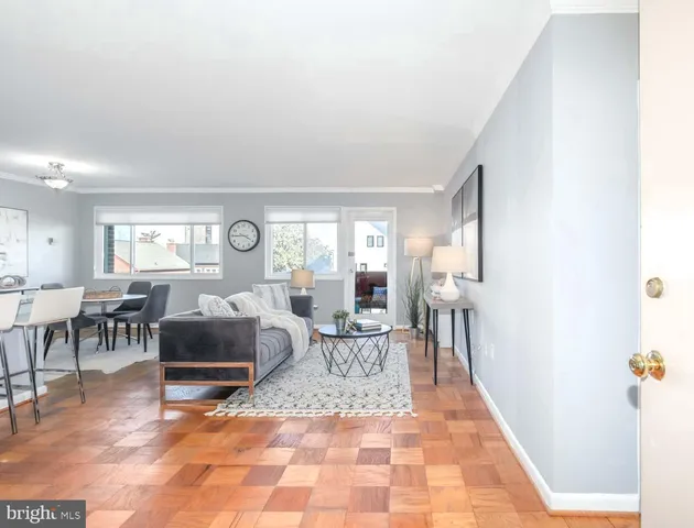 a living room with furniture and a table