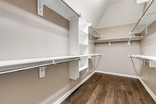 a view of an empty walk in closet