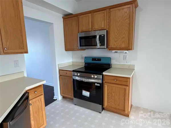 a kitchen with a stove and a microwave