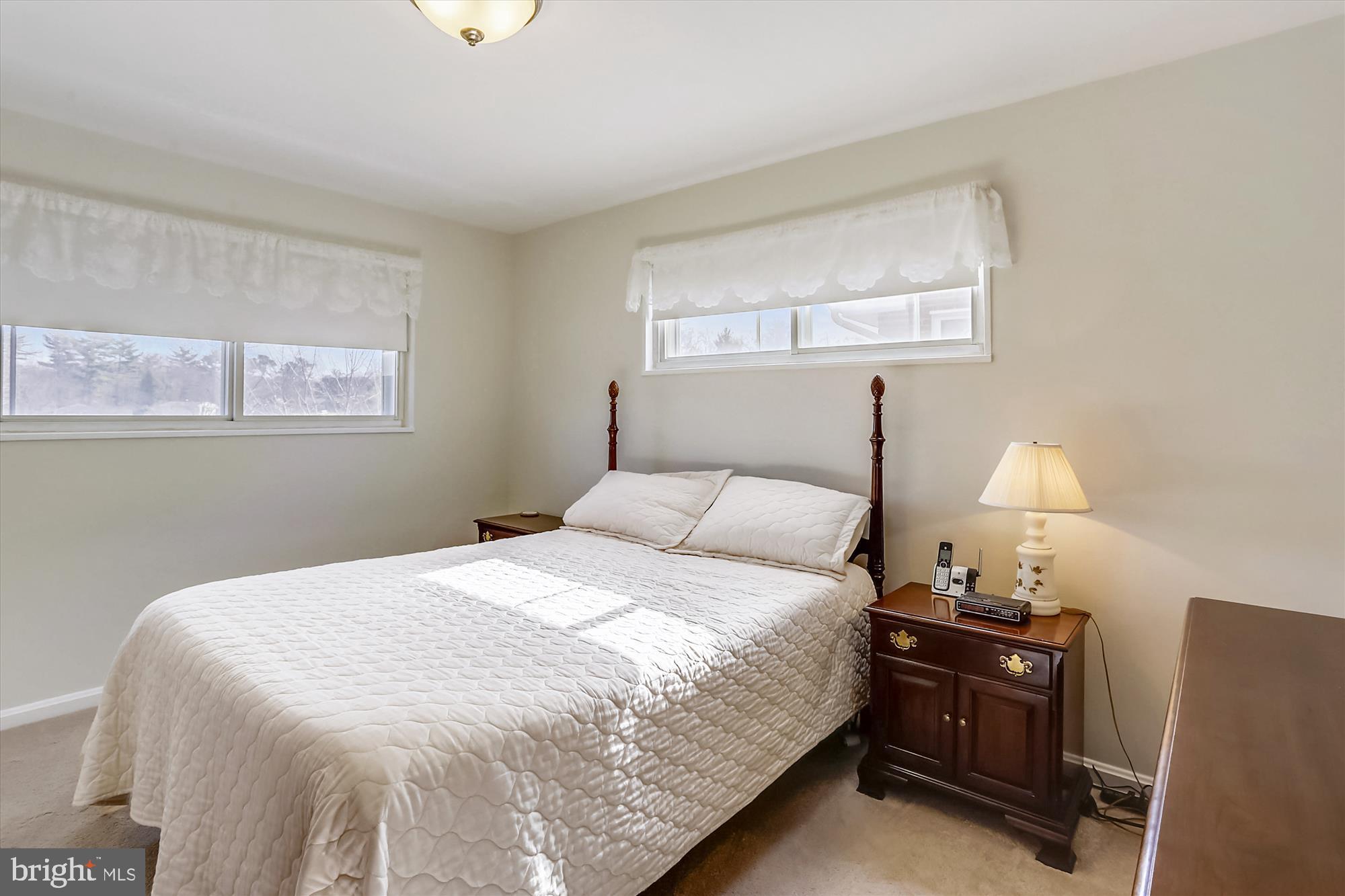 13005 Carney Street Silver Spring, MD 20906 - Photo 14 of 30 a bedroom with a bed and a lamp