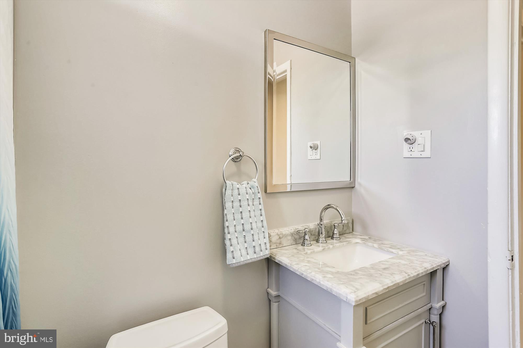 13005 Carney Street Silver Spring, MD 20906 - Photo 18 of 30 a bathroom with a sink toilet and mirror