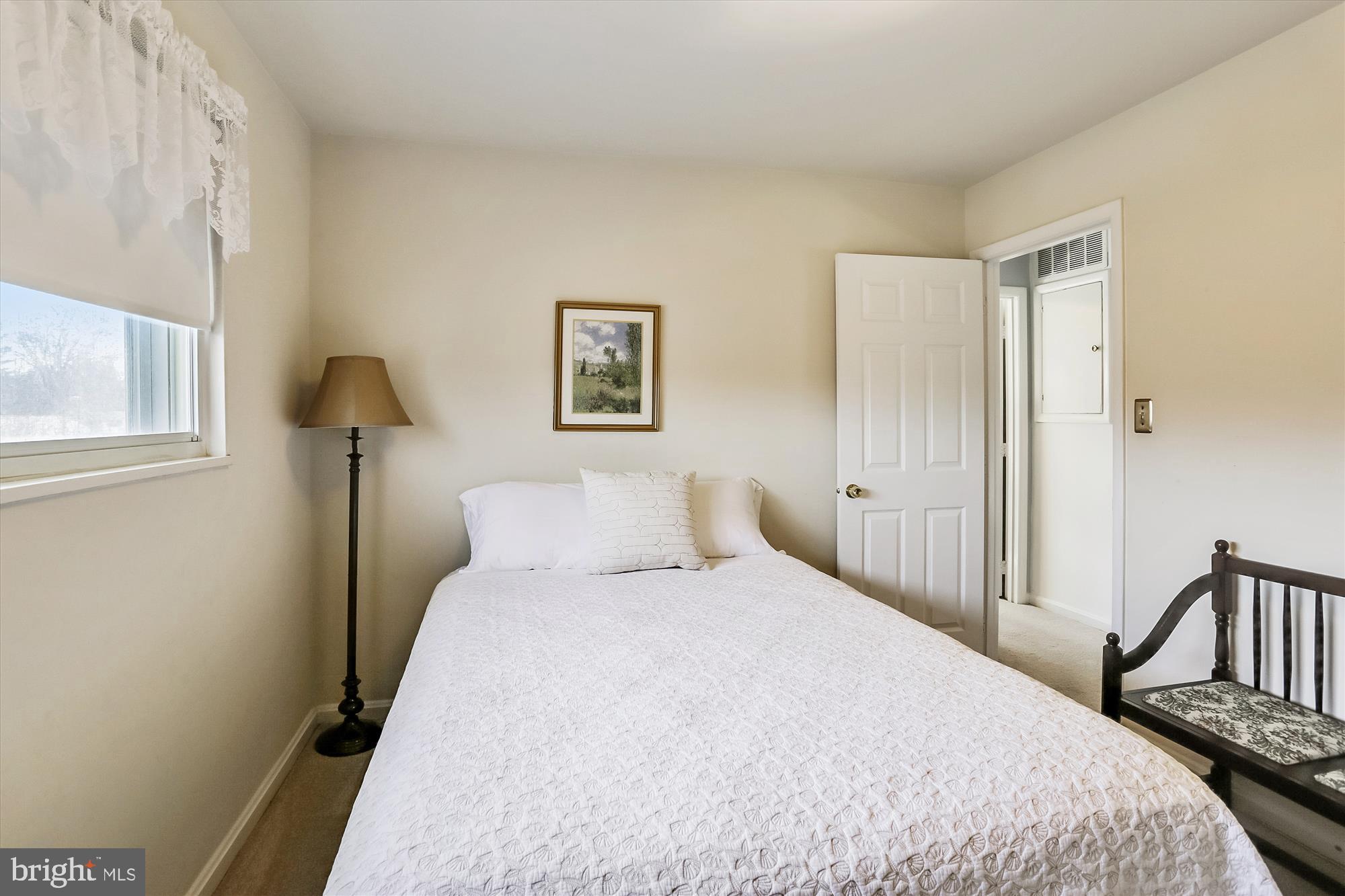 13005 Carney Street Silver Spring, MD 20906 - Photo 22 of 30 a bedroom with a bed and a window