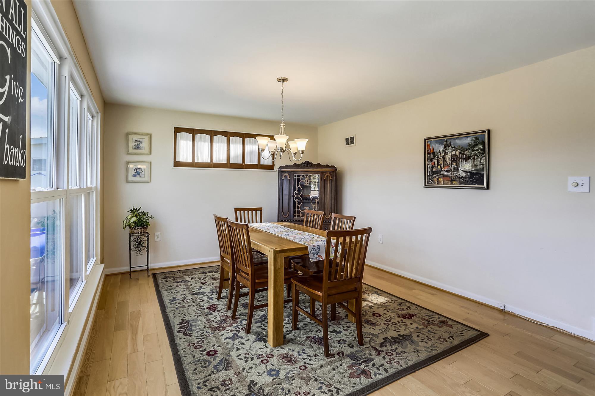 13005 Carney Street Silver Spring, MD 20906 - Photo 7 of 30 a view of a dining room with furniture and wooden floor