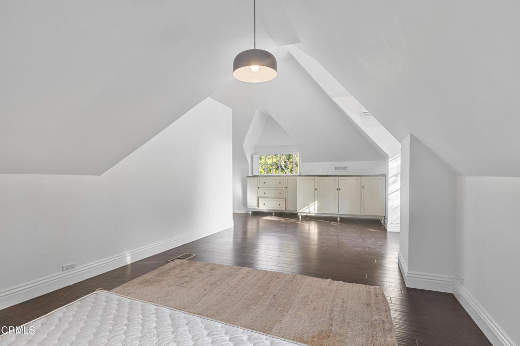 263 San Miguel Road Pasadena, CA 91105 - Photo 17 of 28 a view of an empty room with wooden floor and a window