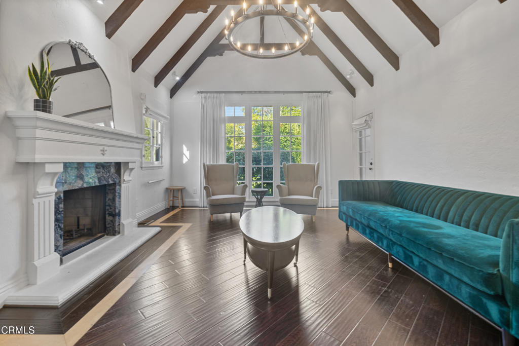 263 San Miguel Road Pasadena, CA 91105 - Photo 6 of 28 a living room with furniture a fireplace and a large window