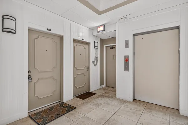 a kitchen with a stove and white cabinets