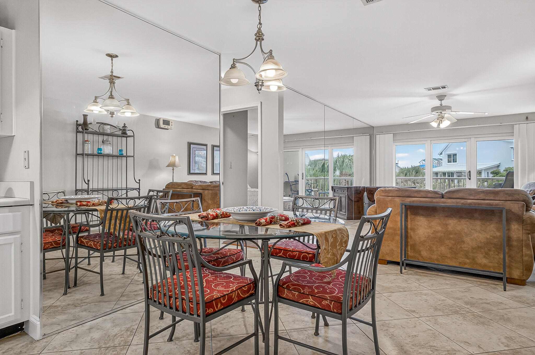 195 Durango Road, Unit 2D Destin, FL 32541 - Photo 20 of 62 a dining room with furniture a chandelier and kitchen view
