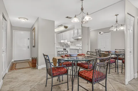 a kitchen with a sink cabinets and appliances