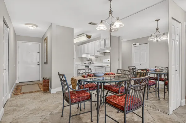 a kitchen with a sink cabinets and appliances