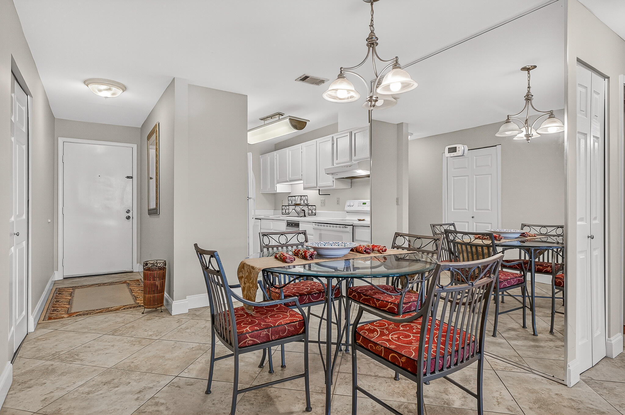 195 Durango Road, Unit 2D Destin, FL 32541 - Photo 21 of 62 a view of a dining room with furniture and a chandelier
