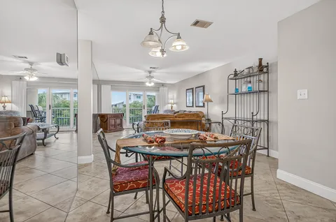 a bathroom with white cabinets and sink