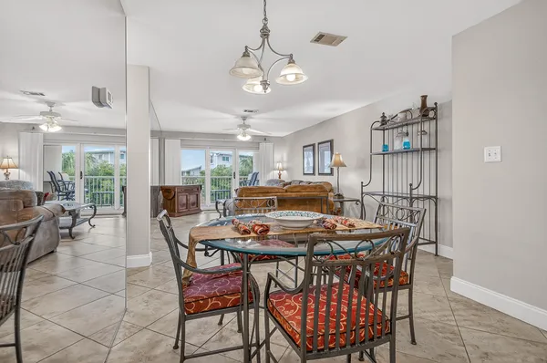 a bathroom with white cabinets and sink