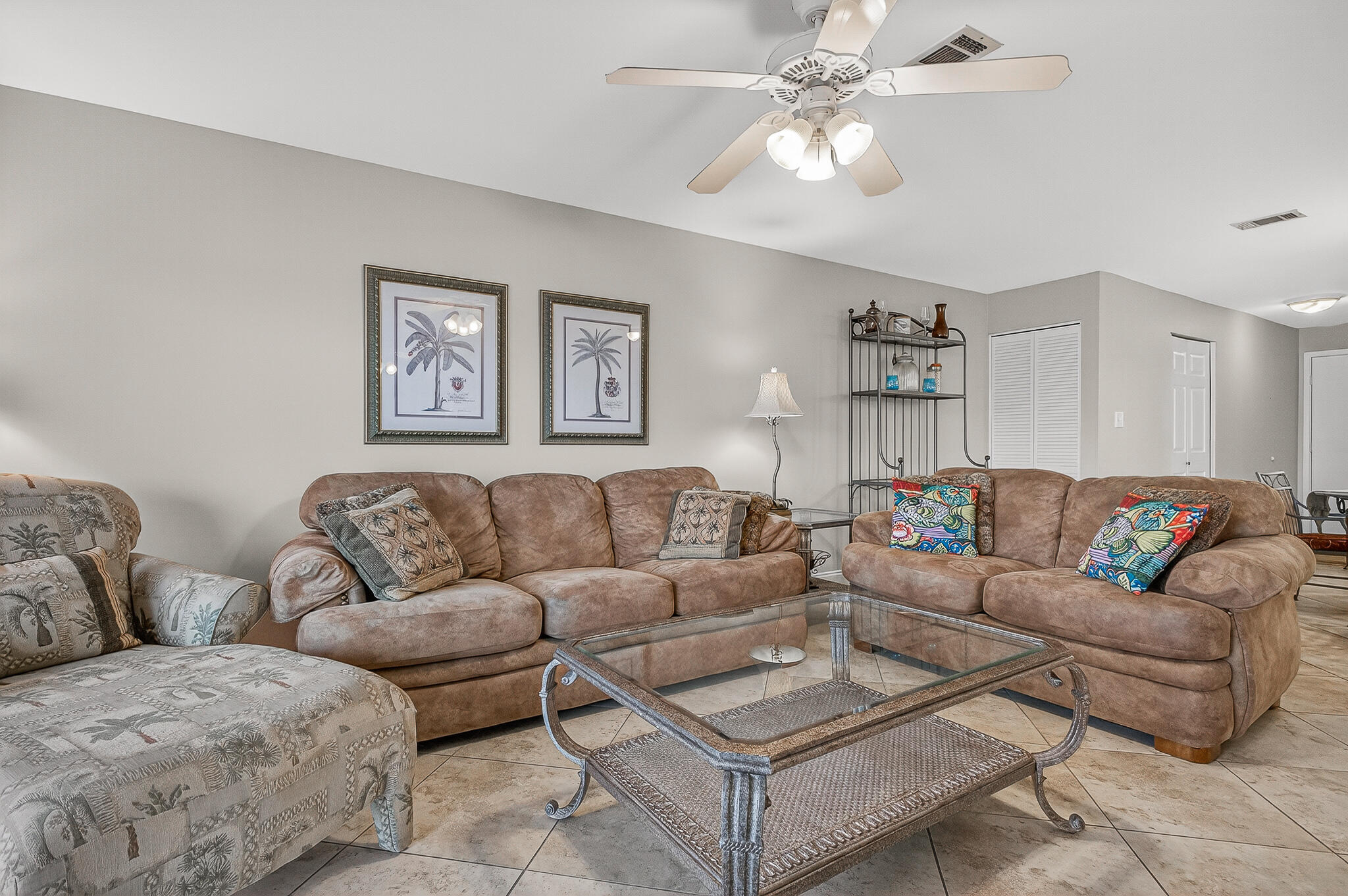 195 Durango Road, Unit 2D Destin, FL 32541 - Photo 33 of 62 a living room with couches and a chandelier