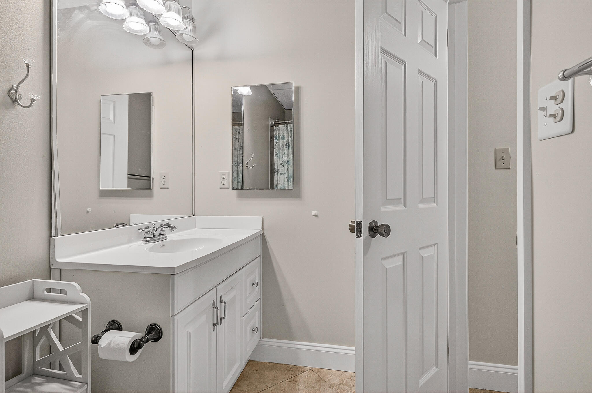 195 Durango Road, Unit 2D Destin, FL 32541 - Photo 41 of 62 a bathroom with a sink vanity and mirror