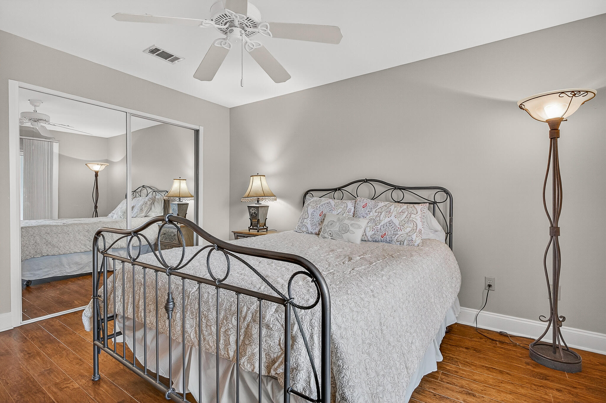 195 Durango Road, Unit 2D Destin, FL 32541 - Photo 44 of 62 a bedroom with a bed and a chandelier