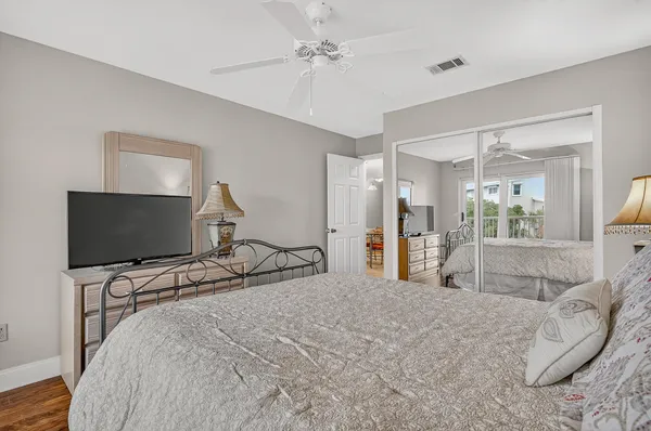 a view of a lake with a table and chairs
