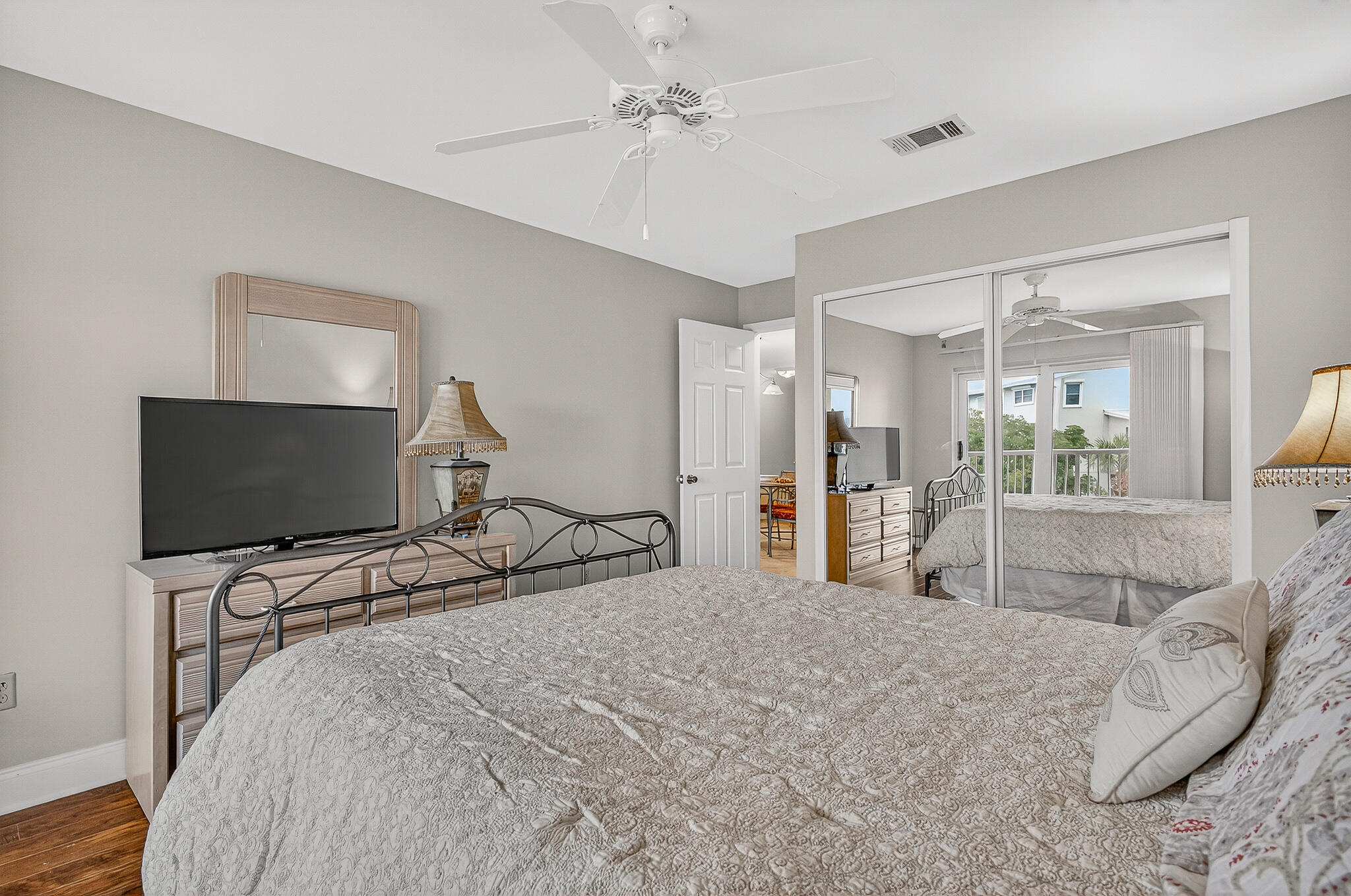 195 Durango Road, Unit 2D Destin, FL 32541 - Photo 45 of 62 a bedroom with a bed and a flat screen tv