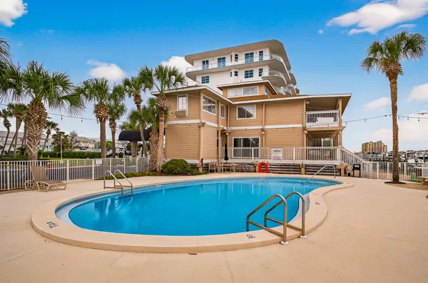 a view of a swimming pool with a lounge chair