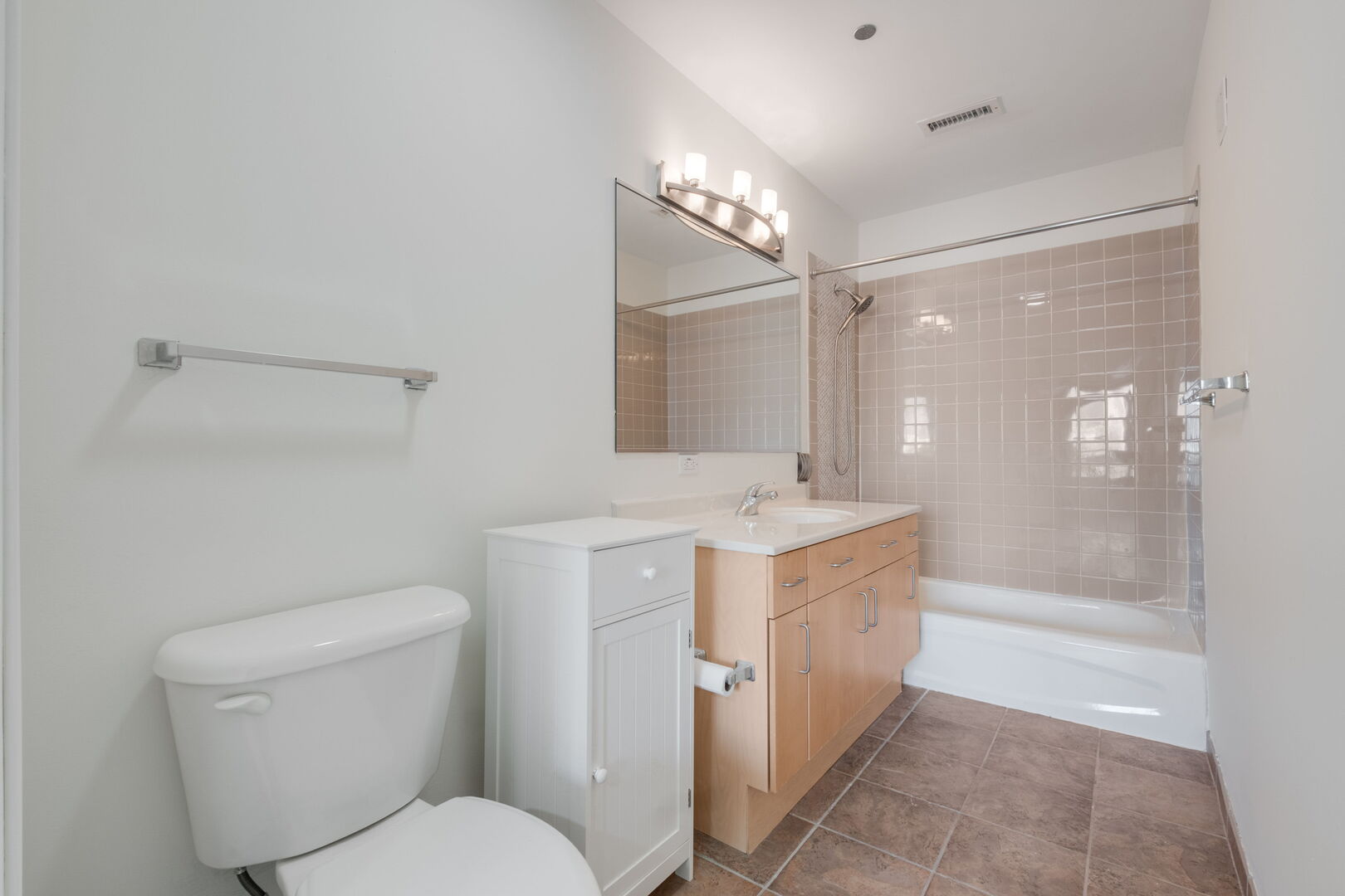 720 West Randolph Street, Unit 905 Chicago, IL 60661 - Photo 19 of 30 a spacious bathroom with a granite countertop sink toilet and shower