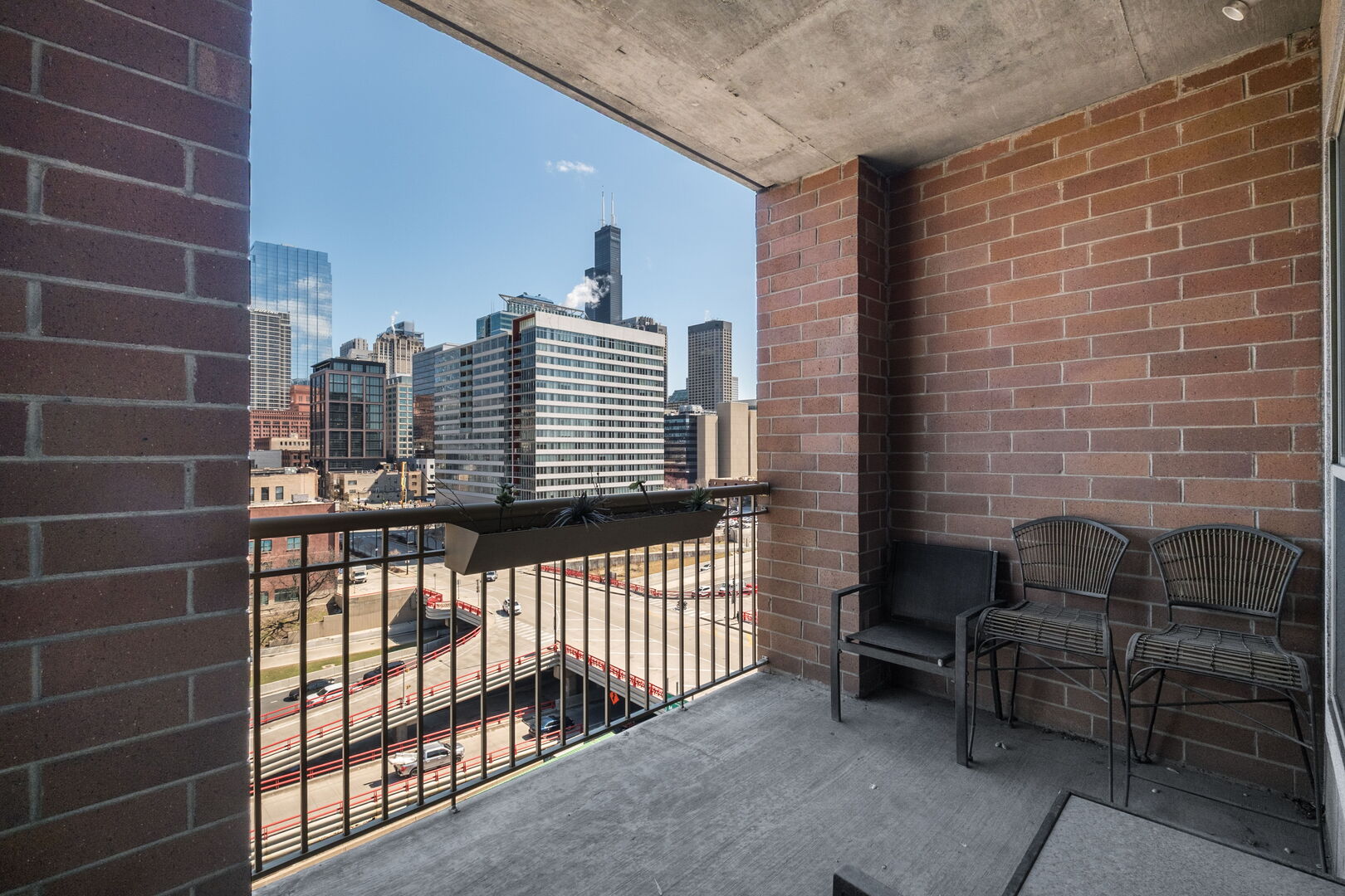 720 West Randolph Street, Unit 905 Chicago, IL 60661 - Photo 21 of 30 a view of a balcony with chairs