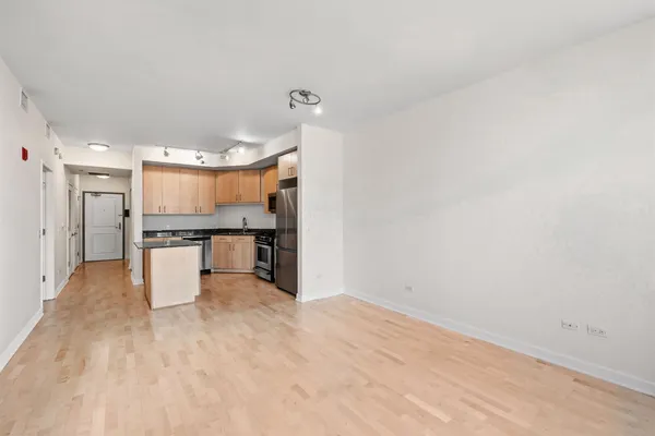 a view of a workspace with furniture and a potted plant