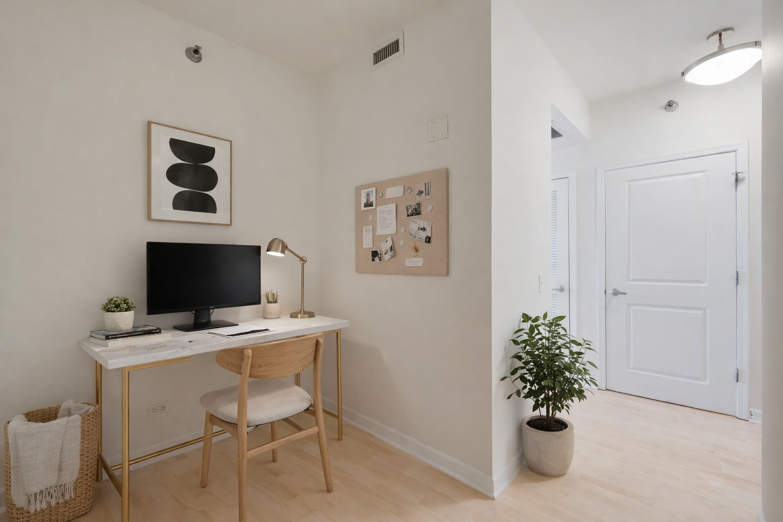 720 West Randolph Street, Unit 905 Chicago, IL 60661 - Photo 10 of 30 a view of a workspace with furniture and a potted plant