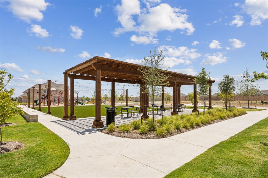 1027 Splitrock Drive Allen, TX 75013 - Photo 14 of 18 a view of a swimming pool with an outdoor seating