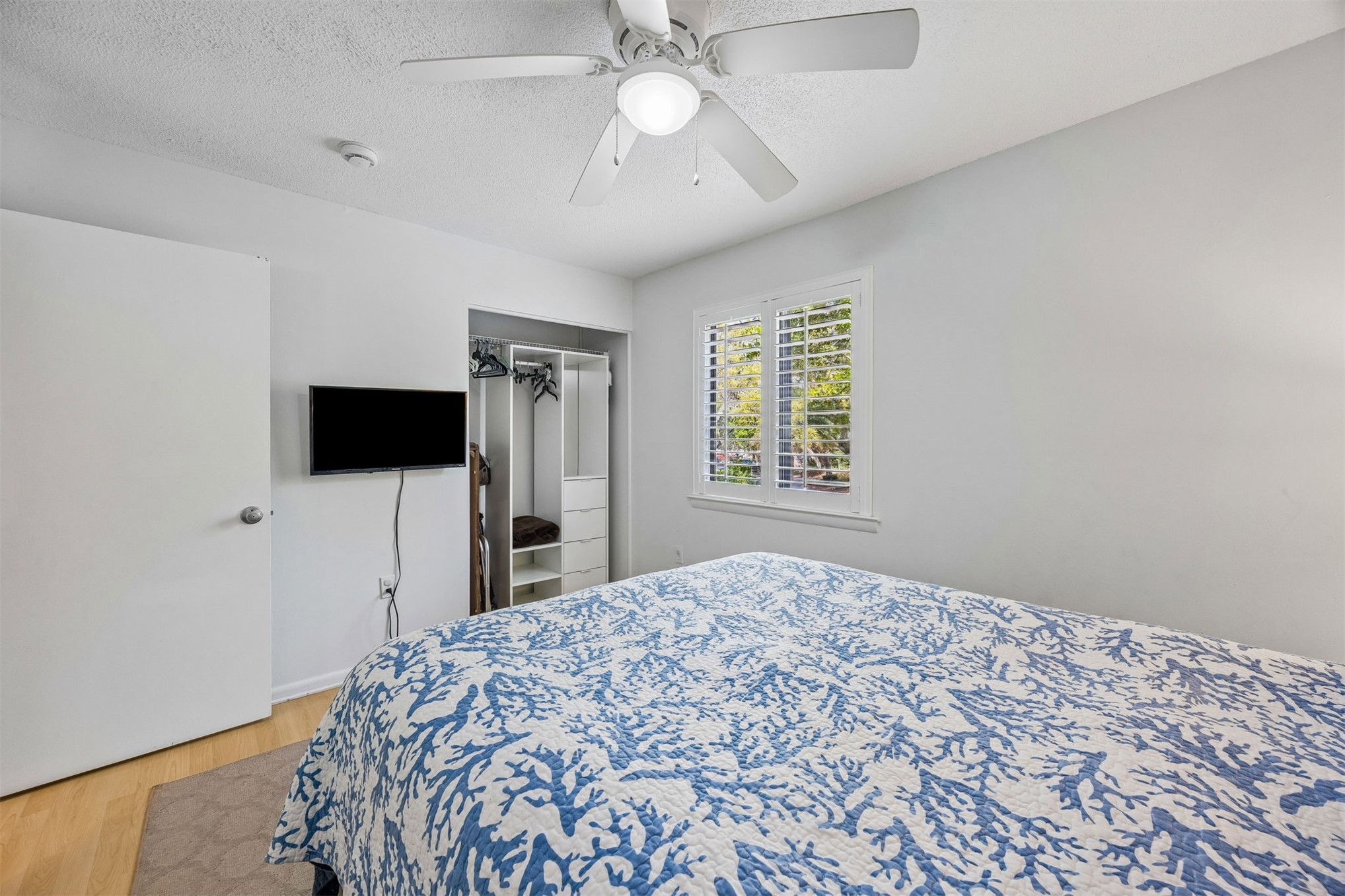 2328 Sadler Road, Unit 1C Fernandina Beach, FL 32034 - Photo 23 of 49 a bedroom with a bed and a flat screen tv